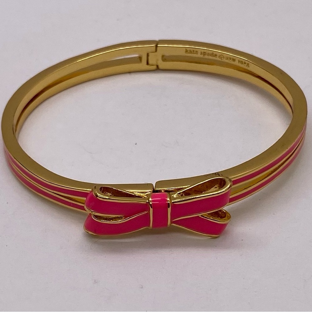 kate spade gold-tone bangle with hot pink enamel bow